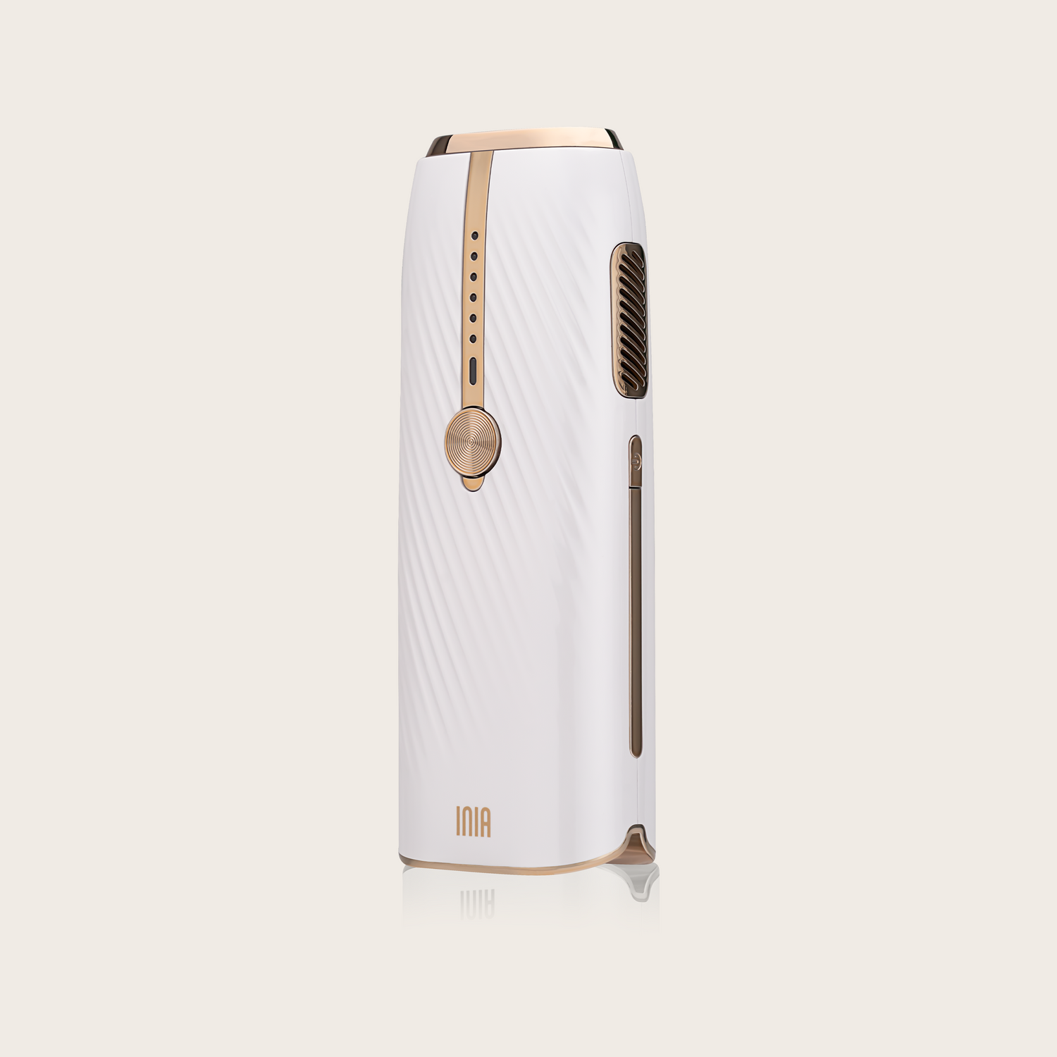 INIA IPL Laser Hair Removal Device in white and gold, modern design for at-home hair removal