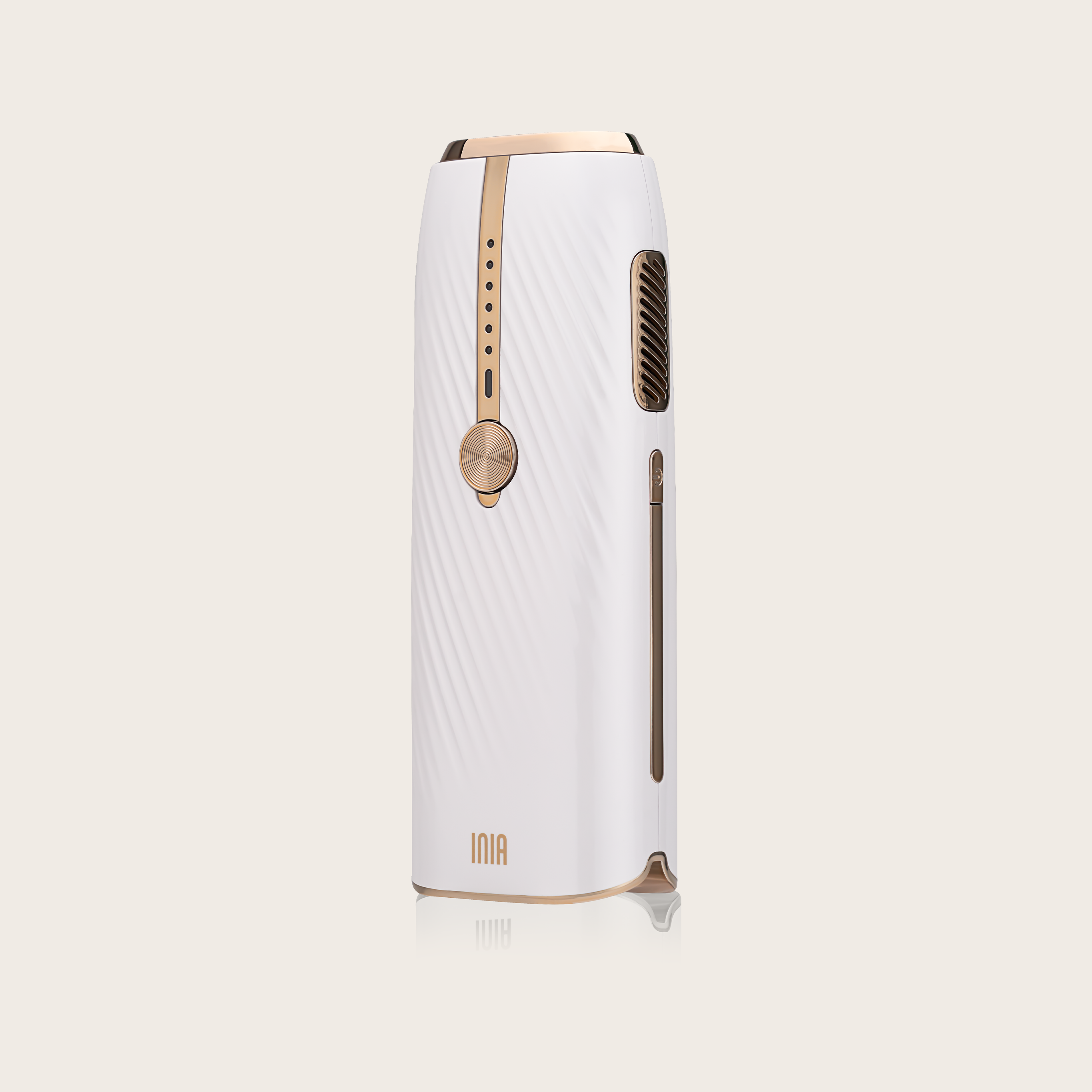 INIA IPL Hair Removal Device, white and gold, at-home hair removal with Sapphire Ice-Cooling.